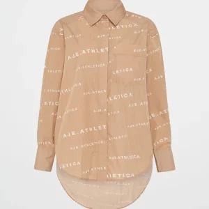 Shop Aje ATHLETICA All Over Logo Spray Shirt 406 Natural Tan / White