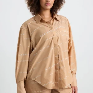 Shop Aje ATHLETICA All Over Logo Spray Shirt 406 Natural Tan / White
