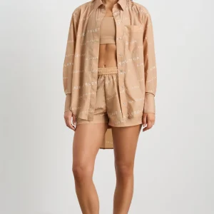 Shop Aje ATHLETICA All Over Logo Spray Shirt 406 Natural Tan / White