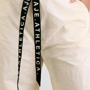 Shop Aje ATHLETICA Belted Windbreak Pant 502 Limestone Beige Black