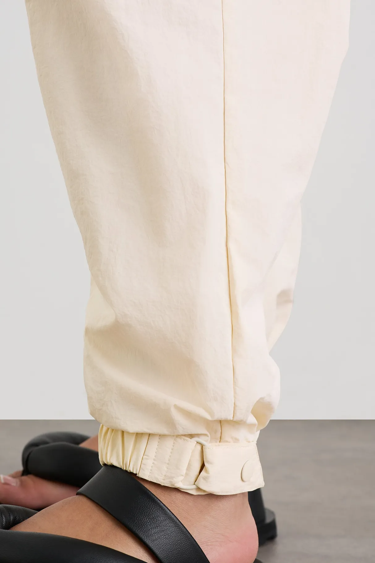 belted_windbreak_pant__14-1.webp Shop Aje ATHLETICA Belted Windbreak Pant 502 Limestone Beige Black