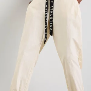 Shop Aje ATHLETICA Belted Windbreak Pant 502 Limestone Beige Black