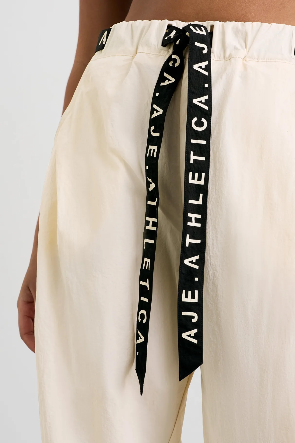 belted_windbreak_pant__8-2.webp Shop Aje ATHLETICA Belted Windbreak Pant 502 Limestone Beige Black