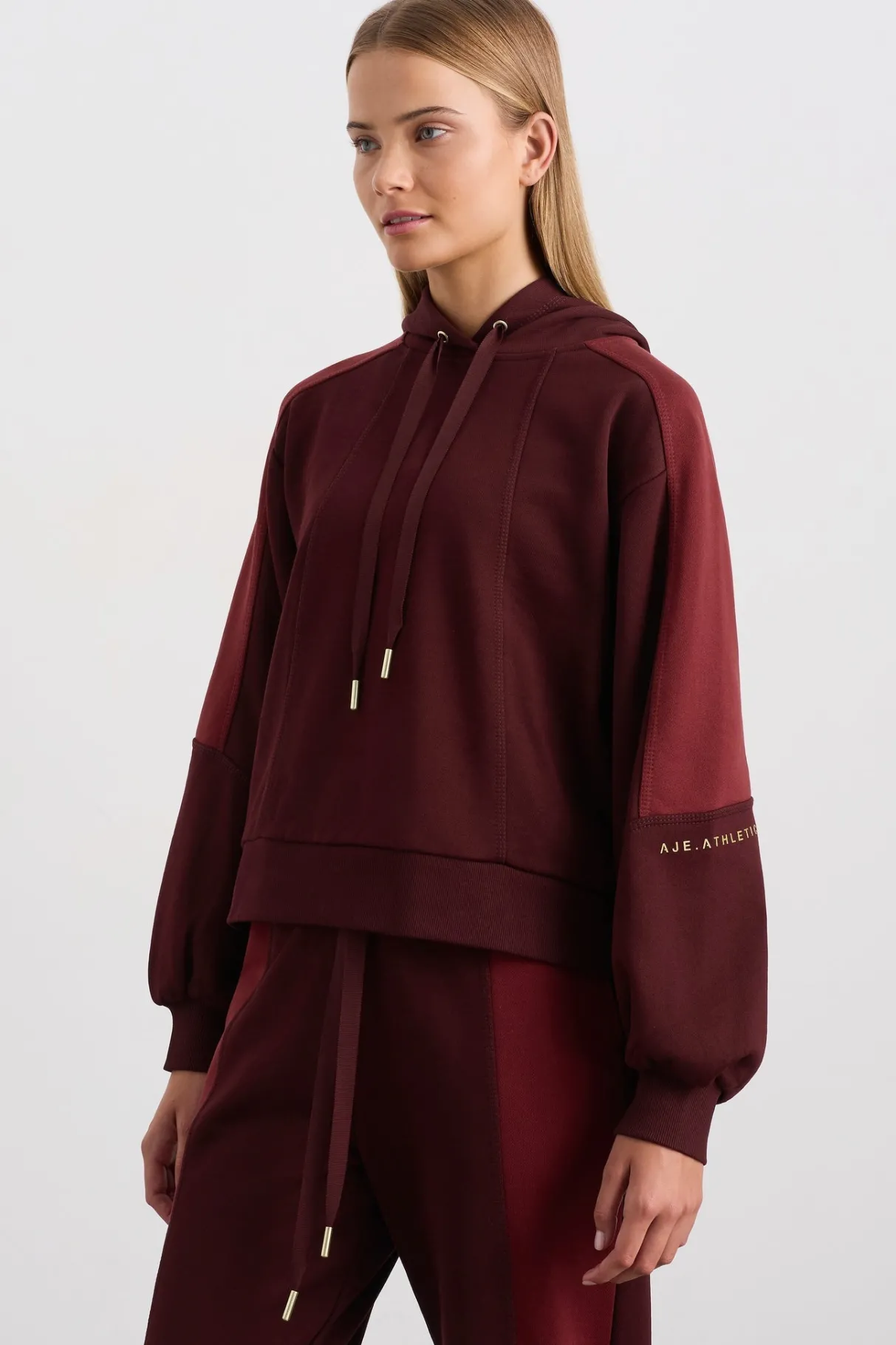 boxy_cropped_hoodie__0.webp Fashion Aje ATHLETICA Boxy Cropped Hoodie 405 Burgundy Red Currant