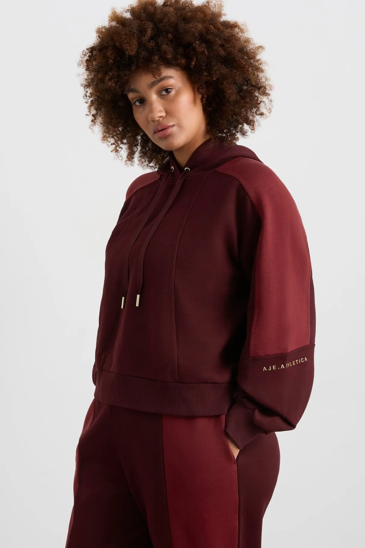 boxy_cropped_hoodie__9.webp Fashion Aje ATHLETICA Boxy Cropped Hoodie 405 Burgundy Red Currant