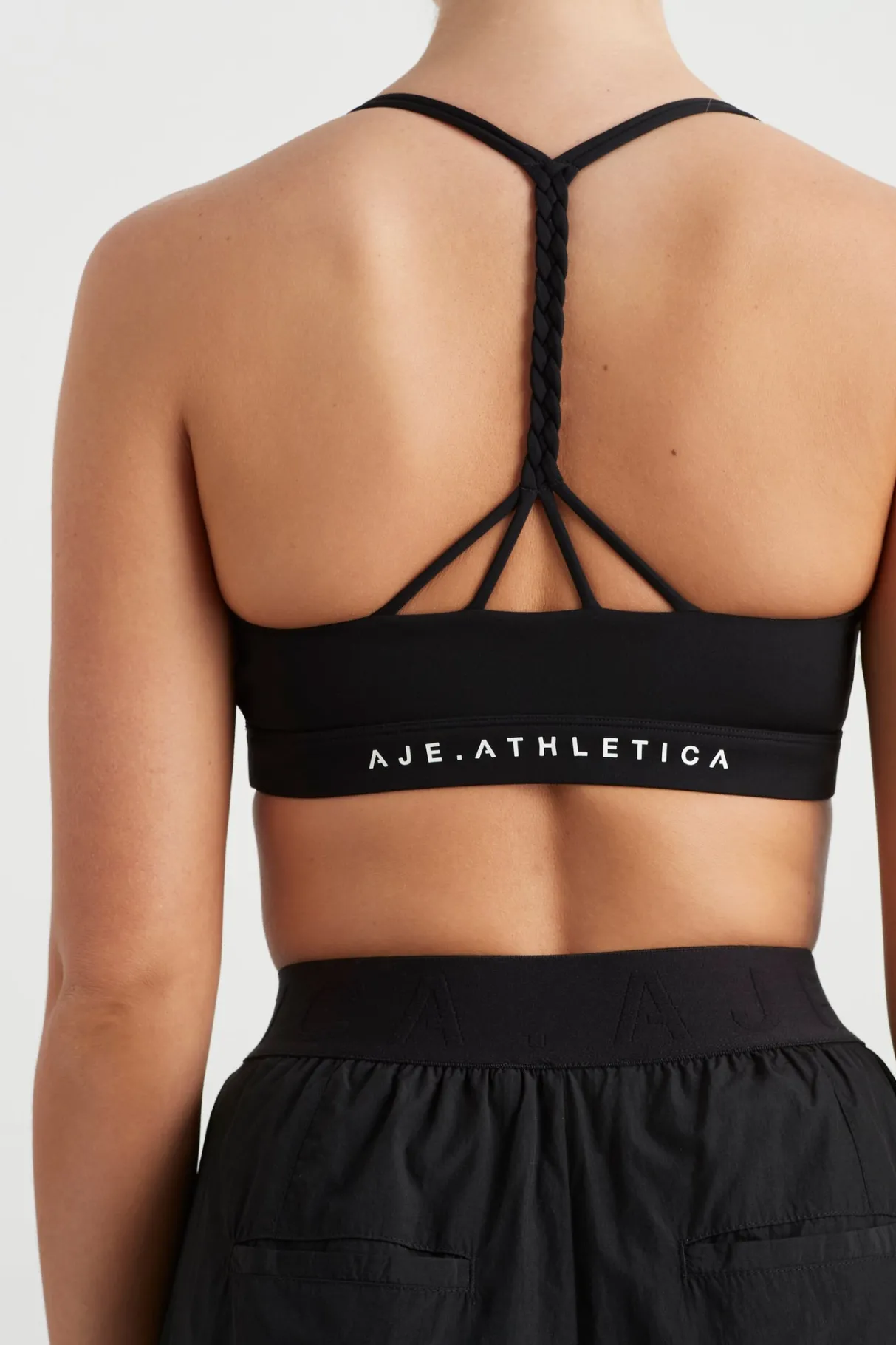 braided_strappy_sports_bra__3-2.webp Cheap Aje ATHLETICA Braided Strappy Sports Bra 334 Black/White