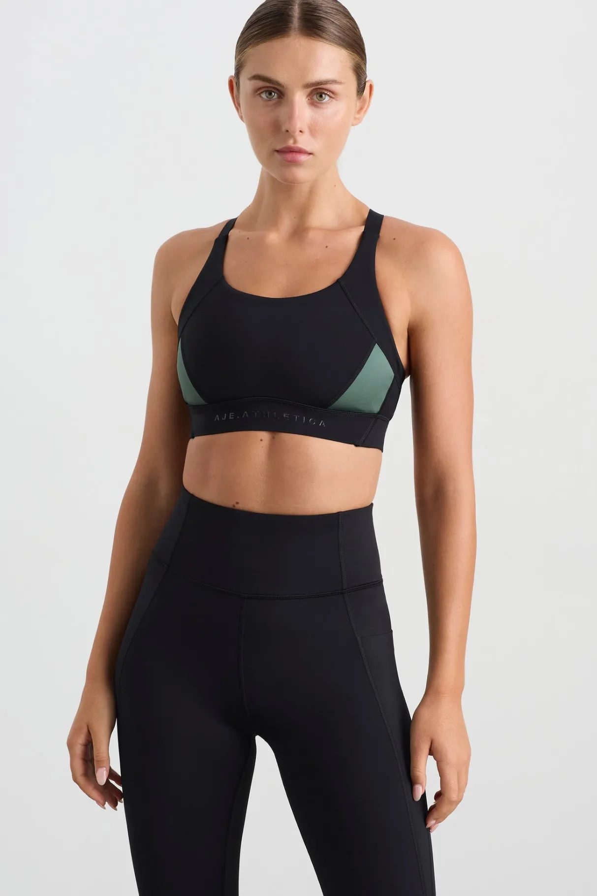 contrast_adjustable_strap_sports_bra__0-1.webp Fashion Aje ATHLETICA Contrast Adjustable Strap Sports Bra 321 Black Moss Green