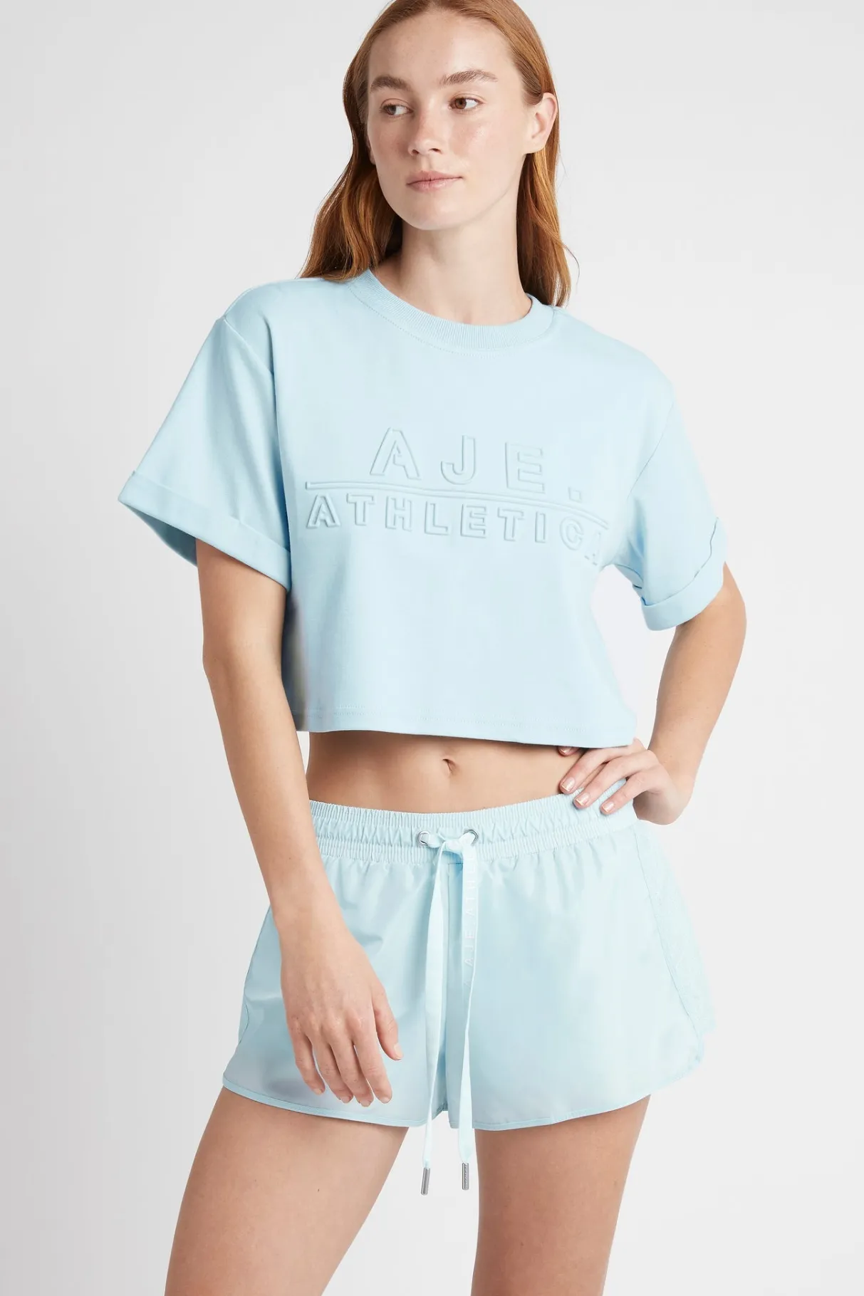 cropped_embossed_classic_logo_tshirt__0-1.webp Hot Aje ATHLETICA Cropped Embossed Classic Logo T-Shirt 105 Ice Blue