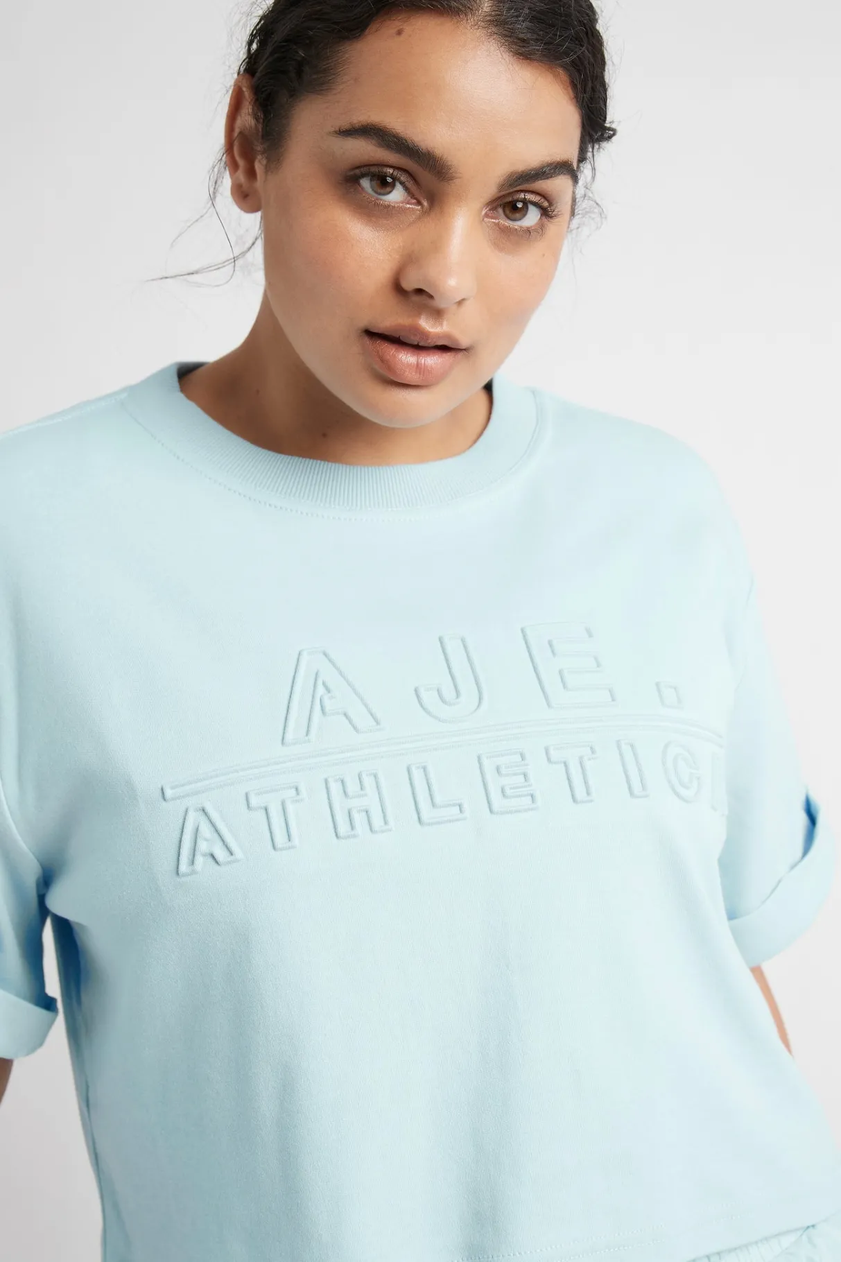 cropped_embossed_classic_logo_tshirt__13-1.webp Hot Aje ATHLETICA Cropped Embossed Classic Logo T-Shirt 105 Ice Blue