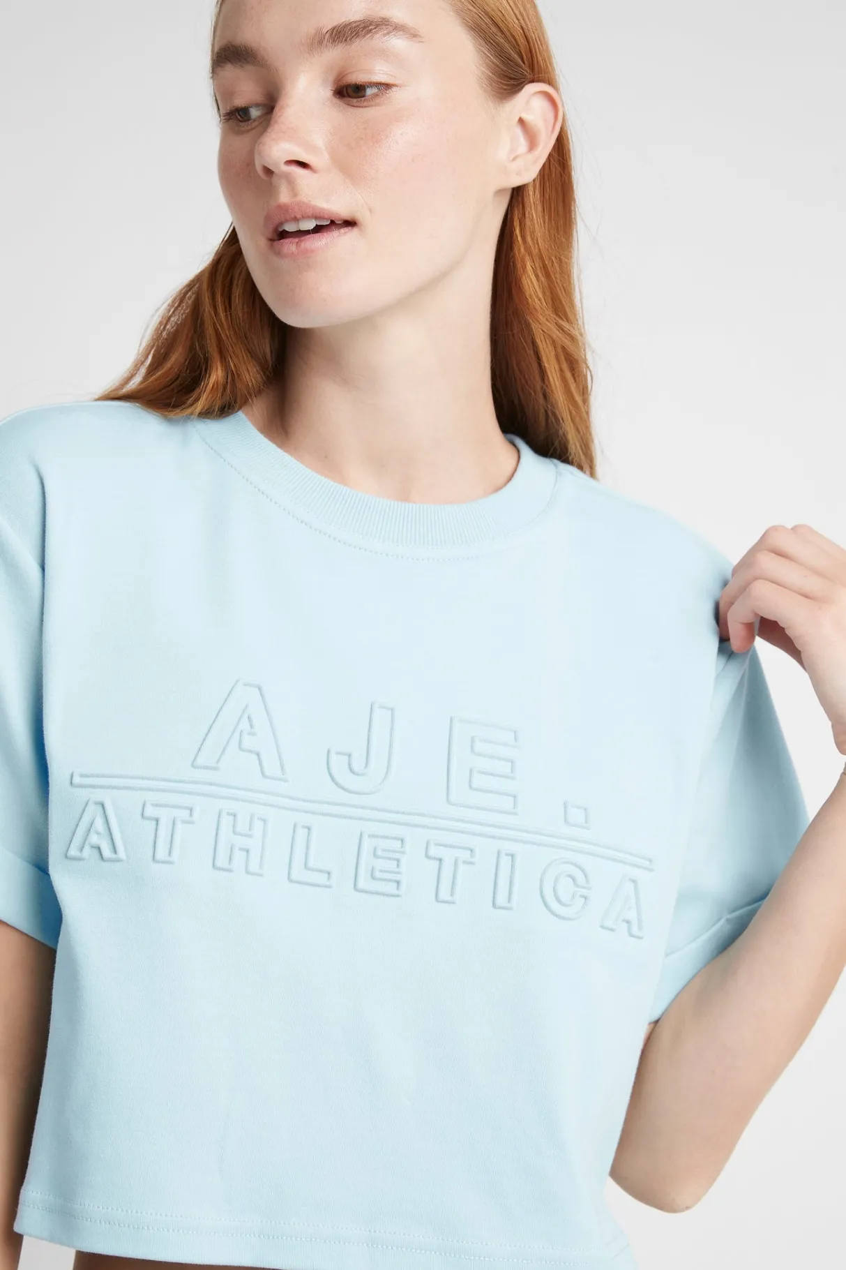 cropped_embossed_classic_logo_tshirt__3-1.webp Hot Aje ATHLETICA Cropped Embossed Classic Logo T-Shirt 105 Ice Blue