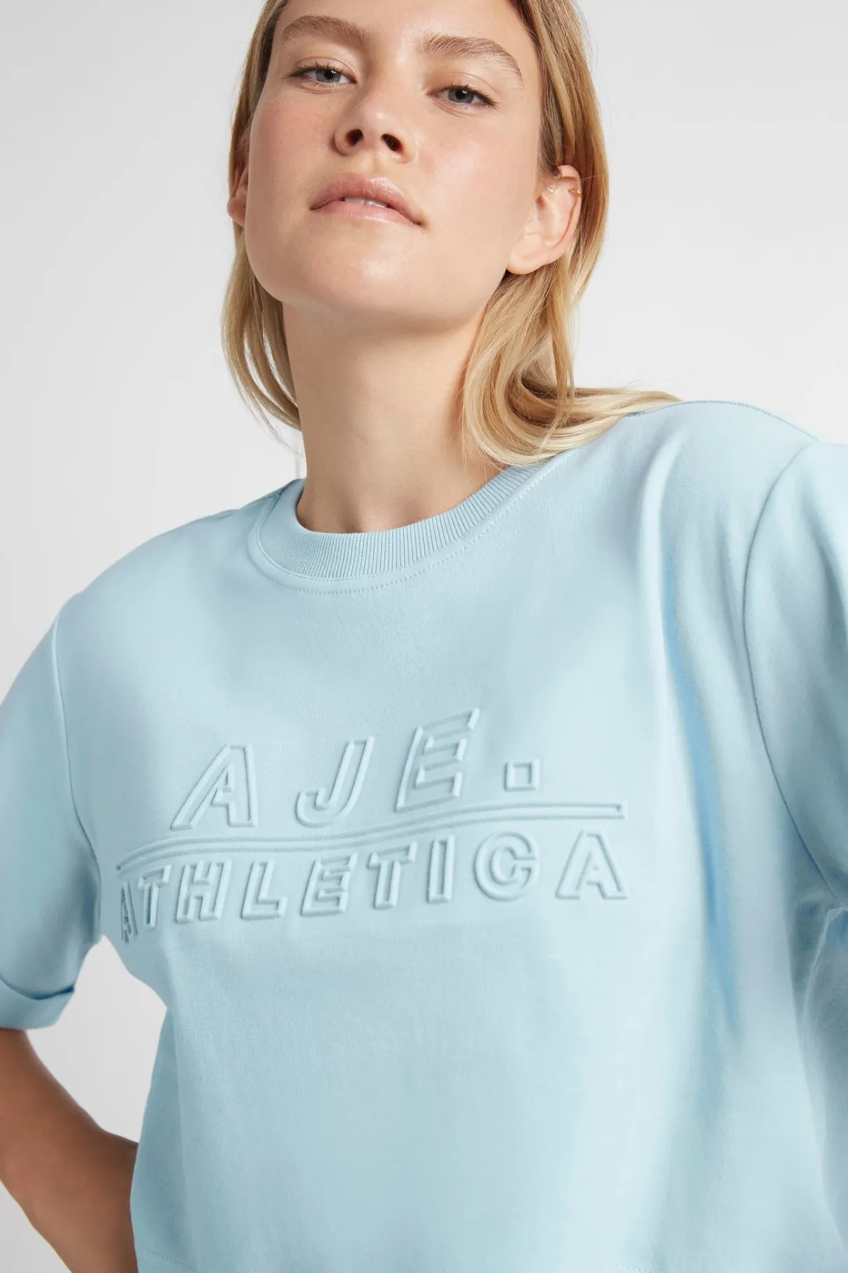 cropped_embossed_classic_logo_tshirt__8-1.webp Hot Aje ATHLETICA Cropped Embossed Classic Logo T-Shirt 105 Ice Blue