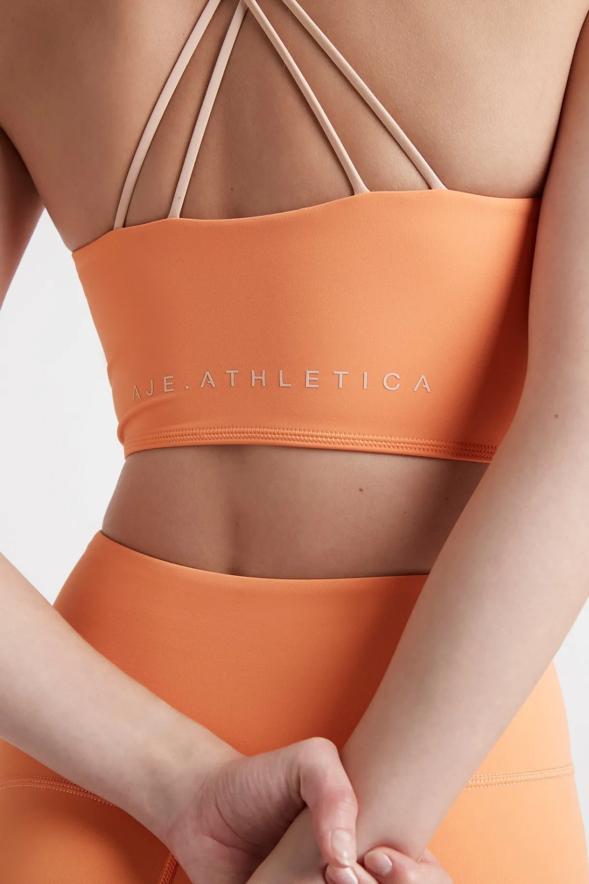 cross_back_crop_top__3-4.webp Best Sale Aje ATHLETICA Cross Back Crop Top 312 Tangerine Orange