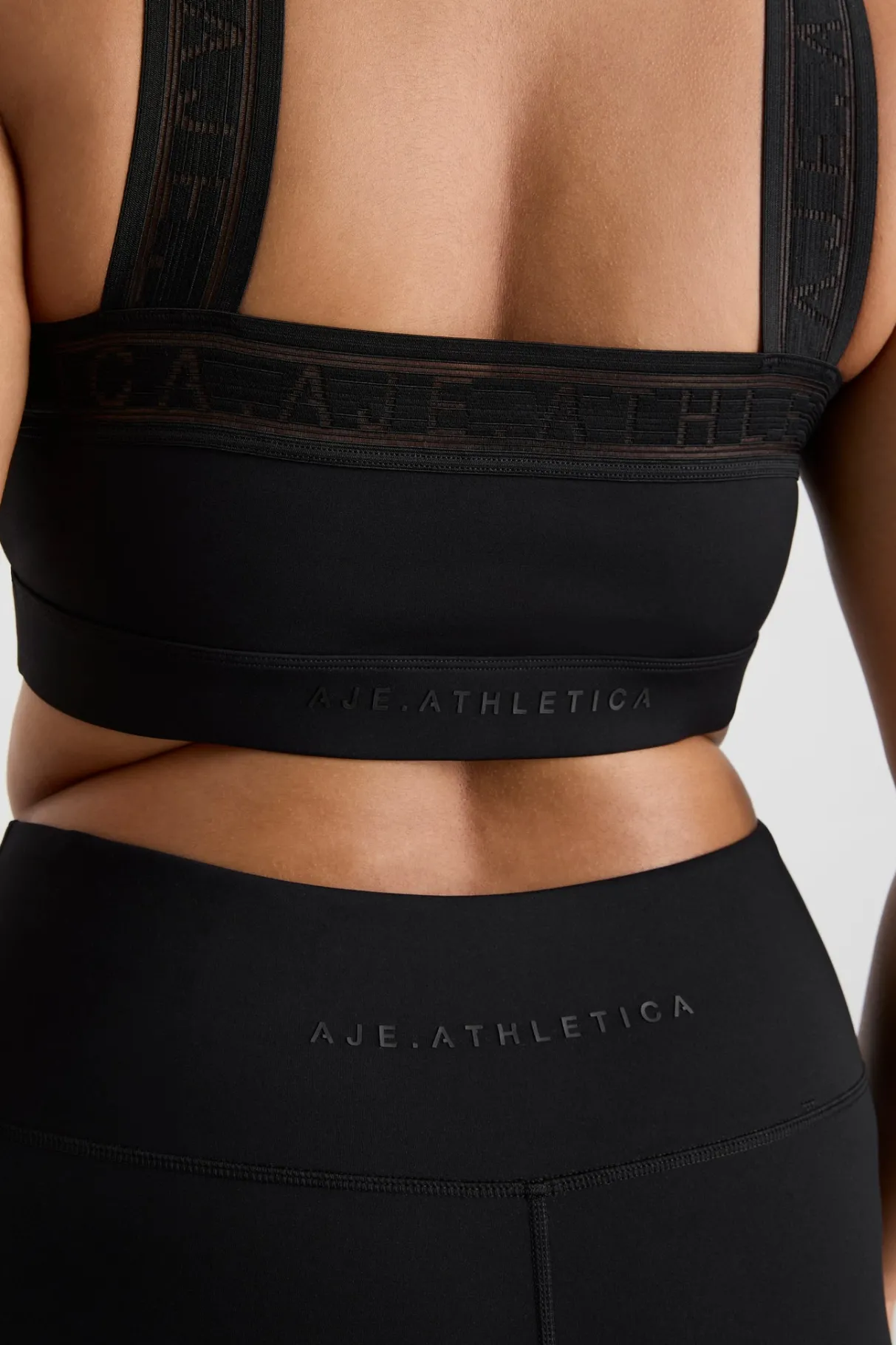 cross_neck_sports_crop__11.webp Outlet Aje ATHLETICA Cross Neck Sports Crop 384 Black