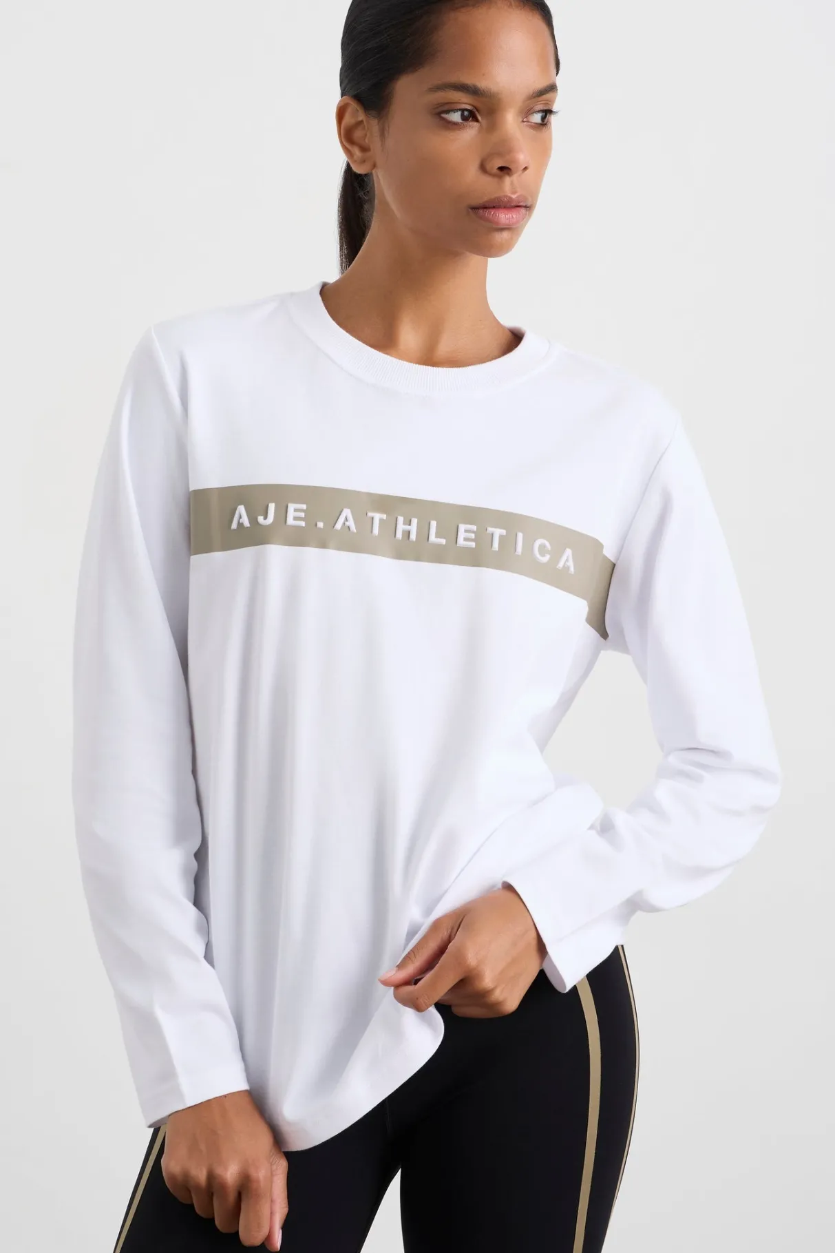 embossed_logo_long_sleeve_tshirt__0.webp Shop Aje ATHLETICA Embossed Logo Long Sleeve T-Shirt 127 White Soft Khaki