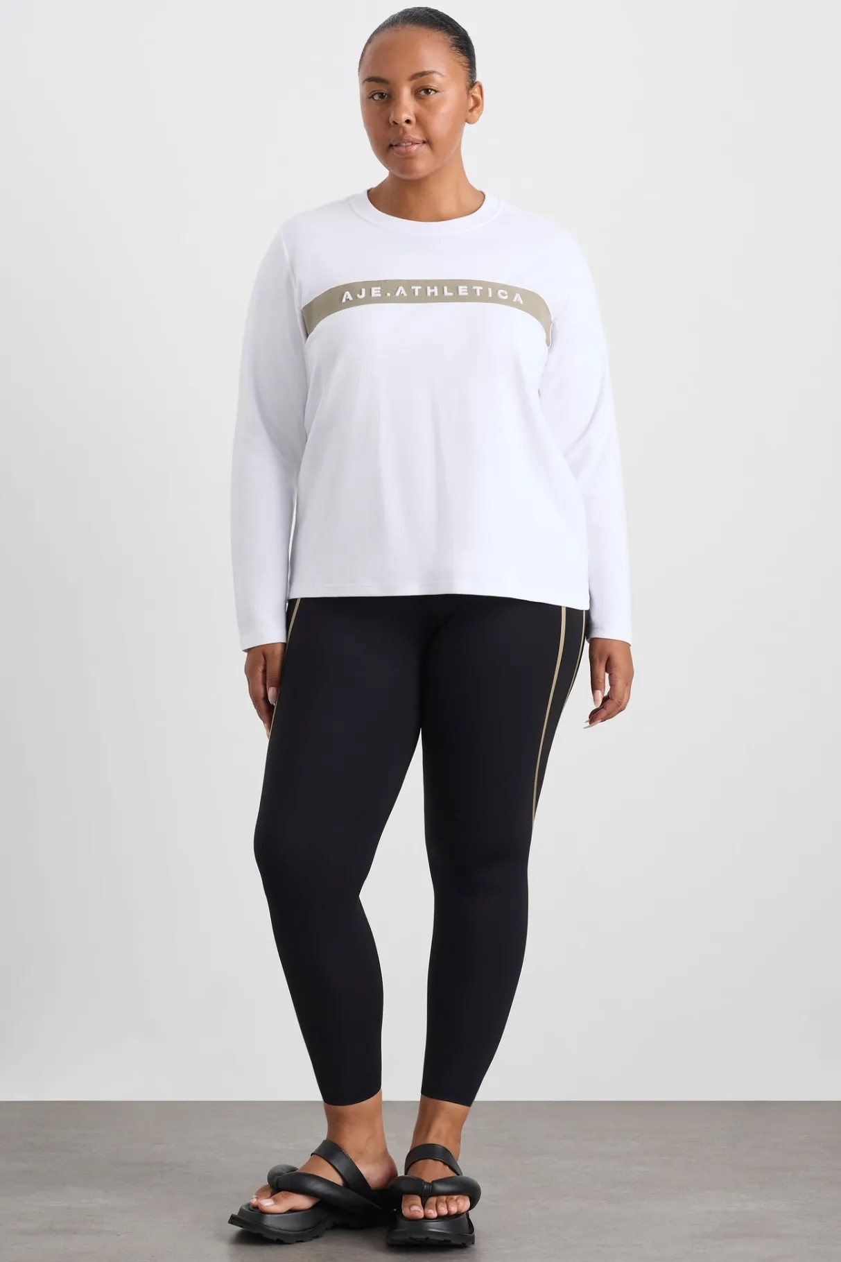 embossed_logo_long_sleeve_tshirt__12.webp Shop Aje ATHLETICA Embossed Logo Long Sleeve T-Shirt 127 White Soft Khaki