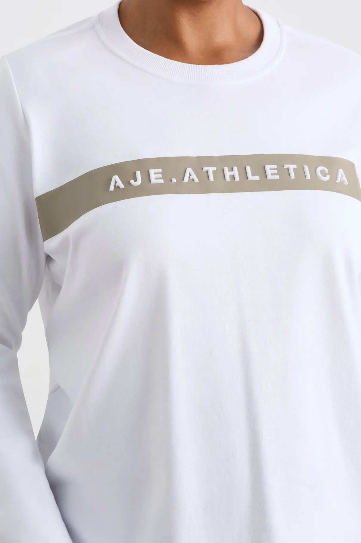 embossed_logo_long_sleeve_tshirt__13.webp Shop Aje ATHLETICA Embossed Logo Long Sleeve T-Shirt 127 White Soft Khaki