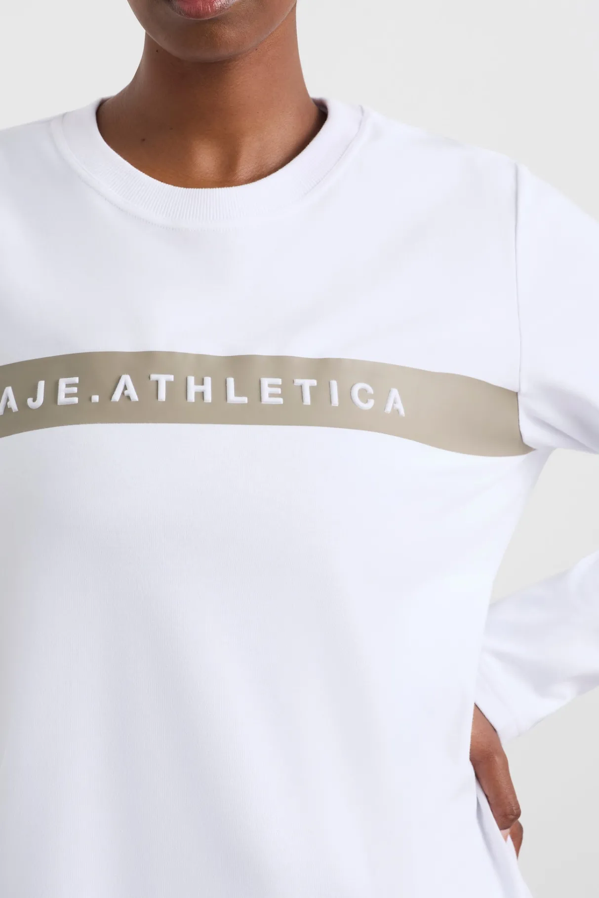 embossed_logo_long_sleeve_tshirt__8.webp Shop Aje ATHLETICA Embossed Logo Long Sleeve T-Shirt 127 White Soft Khaki