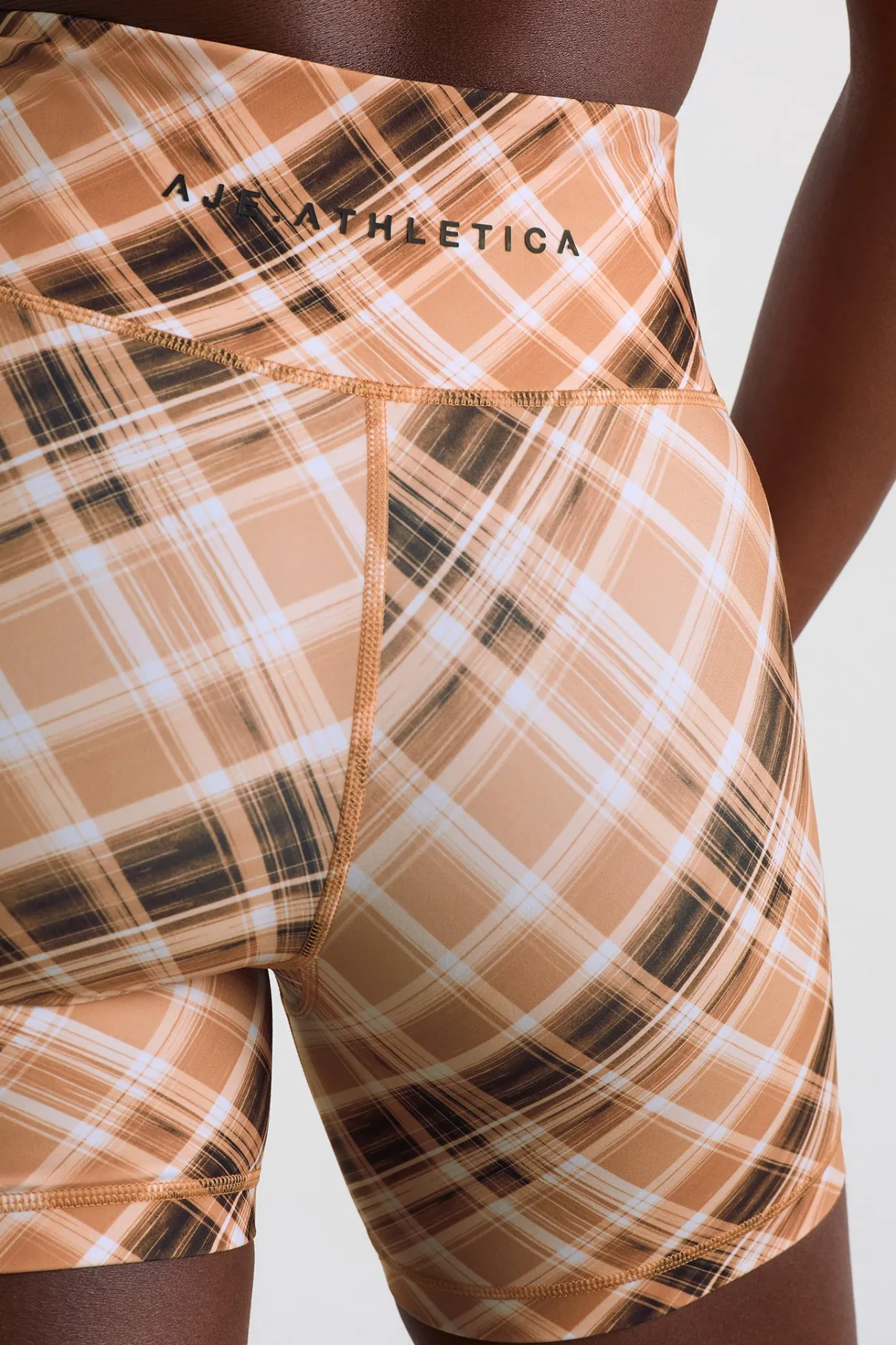 high_rise_bike_shorts__3-4.webp Online Aje ATHLETICA High Rise Bike Shorts 607 Blurred Tan Check