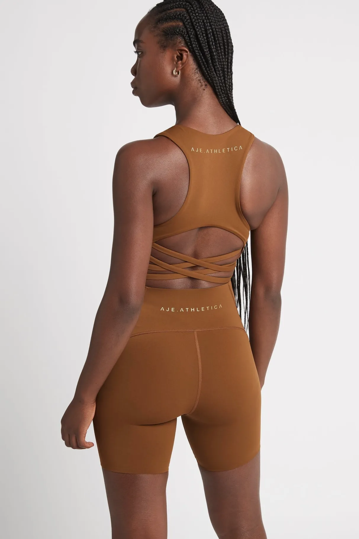 high_rise_mid_length_embossed_bike_short__4.webp Discount Aje ATHLETICA High Rise Mid Length Embossed Bike Short 615 Coffee/Gold