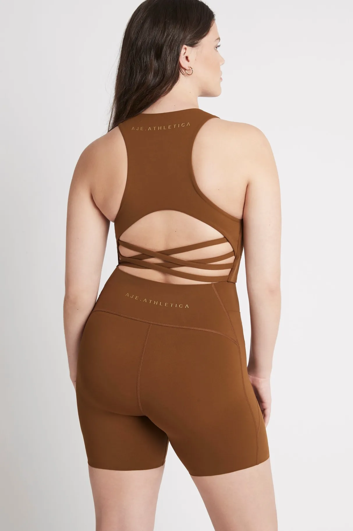 high_rise_mid_length_embossed_bike_short__9.webp Discount Aje ATHLETICA High Rise Mid Length Embossed Bike Short 615 Coffee/Gold