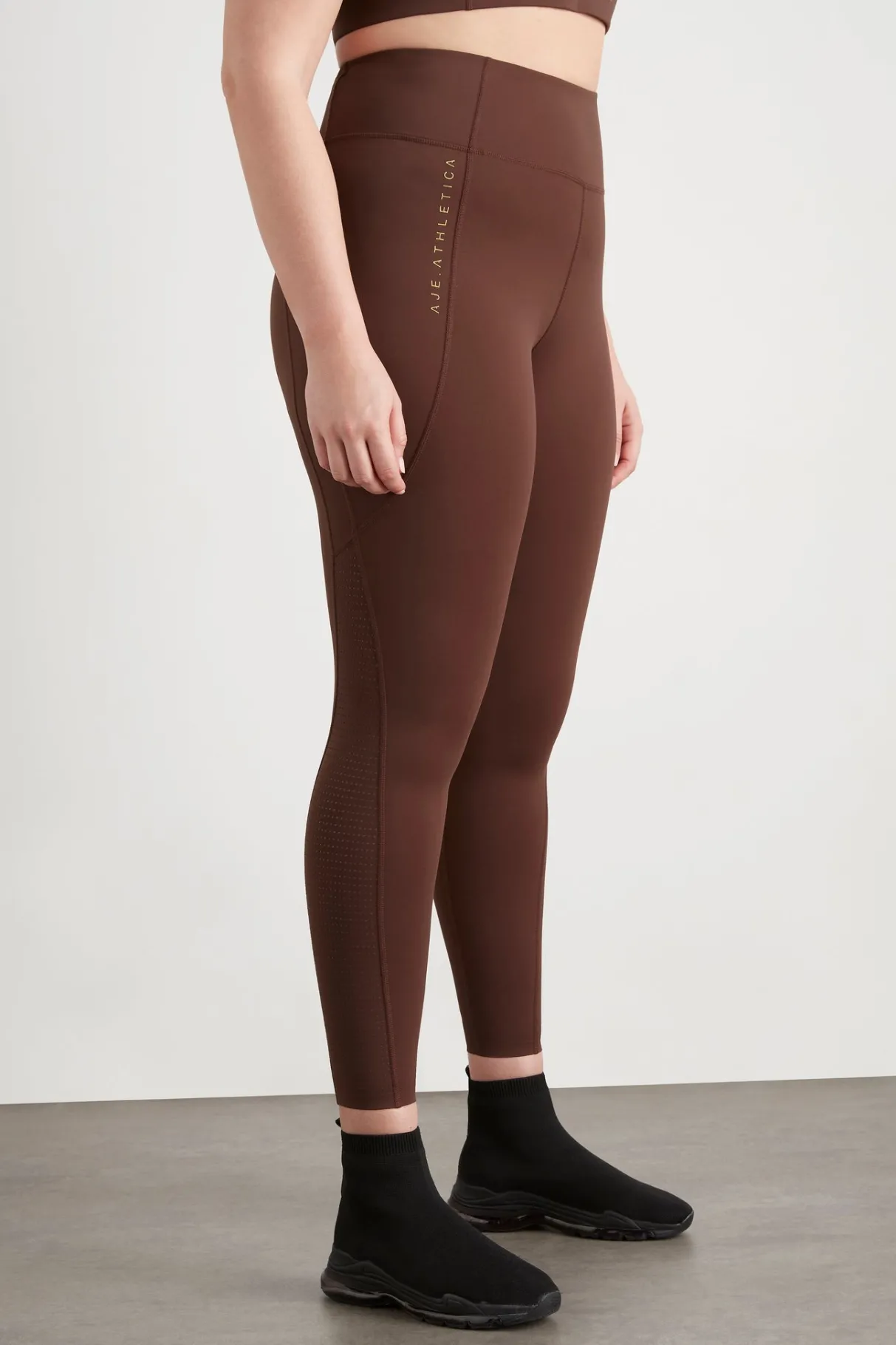 high_rise_perforated_hem_full_length_legging__13.webp Best Aje ATHLETICA High Rise Perforated Hem Full Length Legging 227 Dark Chocolate