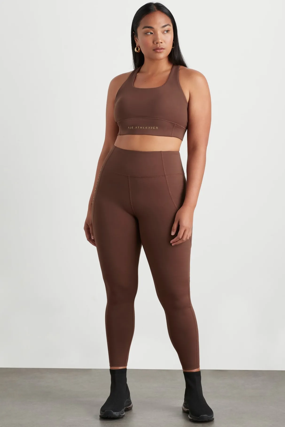 high_rise_perforated_hem_full_length_legging__6.webp Best Aje ATHLETICA High Rise Perforated Hem Full Length Legging 227 Dark Chocolate
