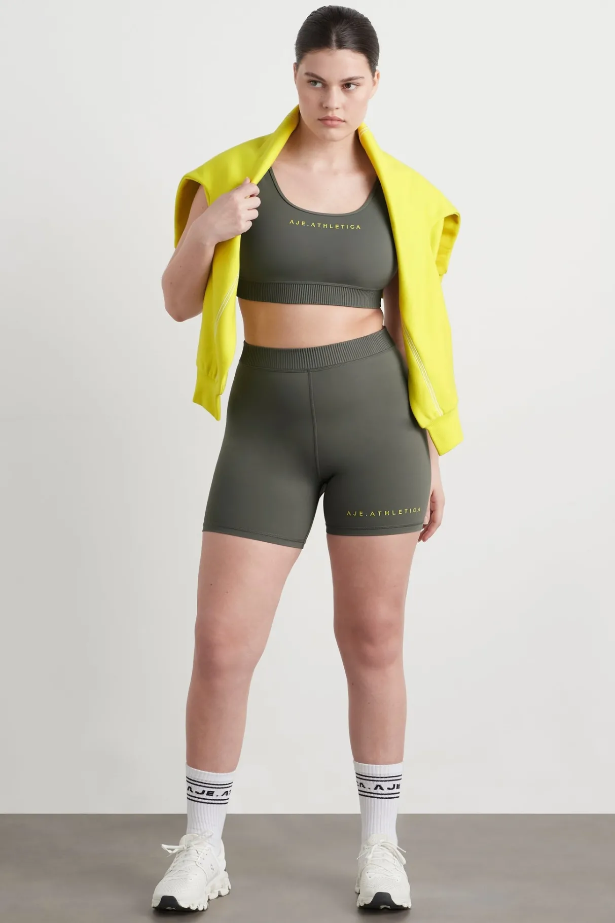 high_rise_pintuck_mid_length_bike_shorts__11.webp Discount Aje ATHLETICA High Rise Pintuck Mid Length Bike Shorts 625 Midnight Grey/Citrus Yellow
