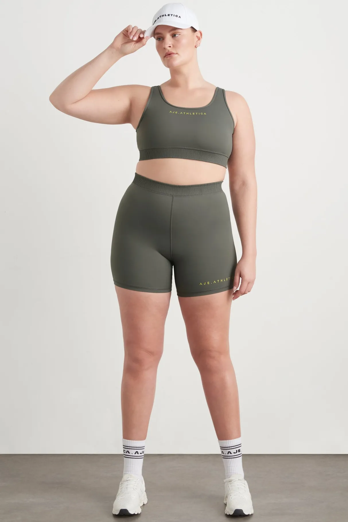 high_rise_pintuck_mid_length_bike_shorts__12.webp Discount Aje ATHLETICA High Rise Pintuck Mid Length Bike Shorts 625 Midnight Grey/Citrus Yellow