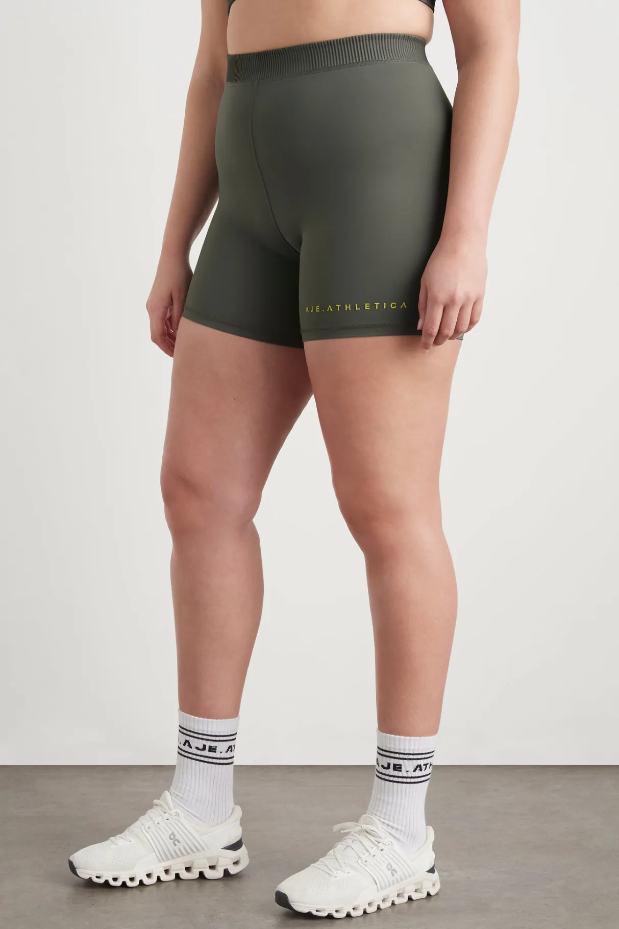high_rise_pintuck_mid_length_bike_shorts__13.webp Discount Aje ATHLETICA High Rise Pintuck Mid Length Bike Shorts 625 Midnight Grey/Citrus Yellow