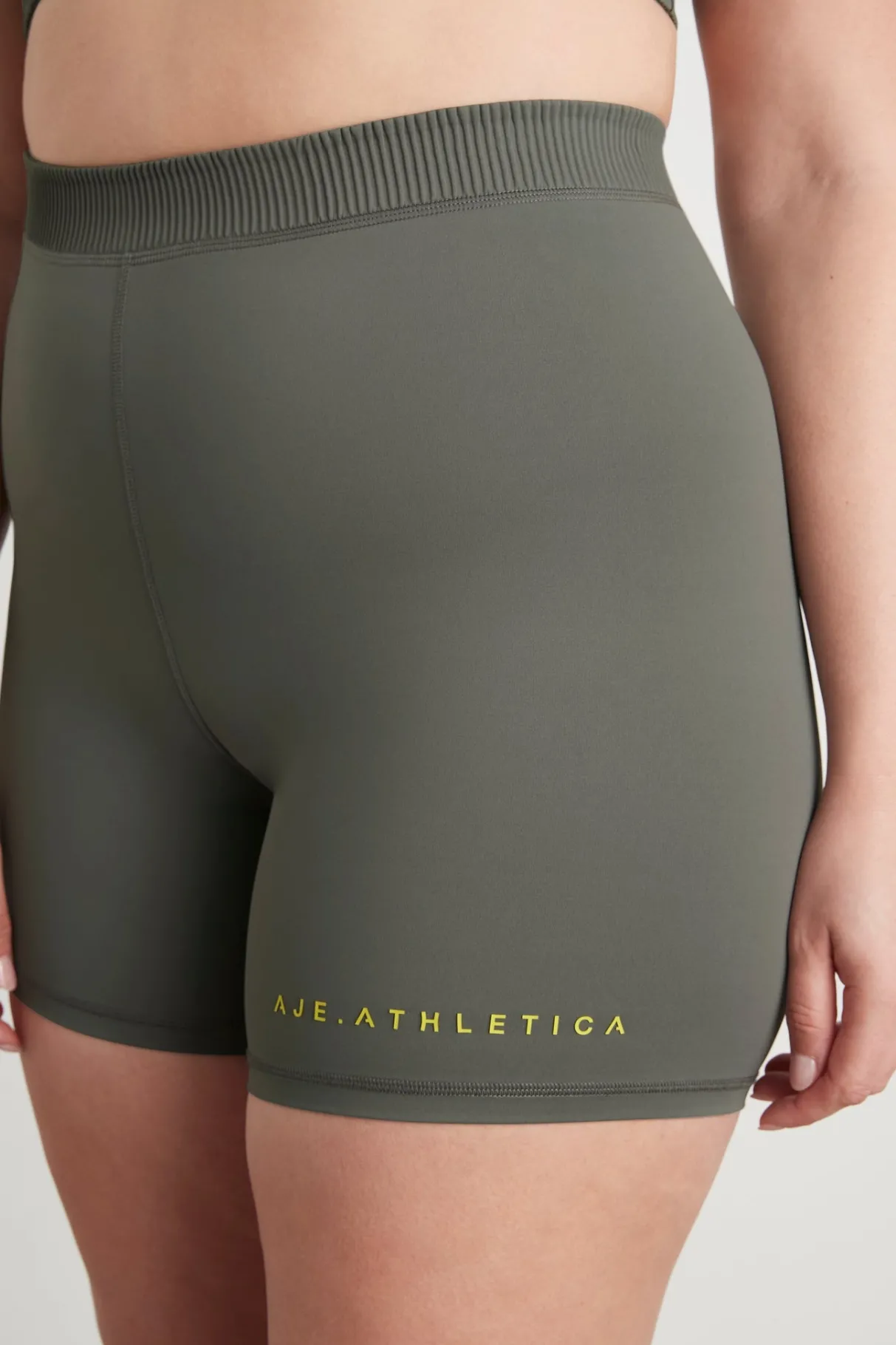 high_rise_pintuck_mid_length_bike_shorts__14.webp Discount Aje ATHLETICA High Rise Pintuck Mid Length Bike Shorts 625 Midnight Grey/Citrus Yellow