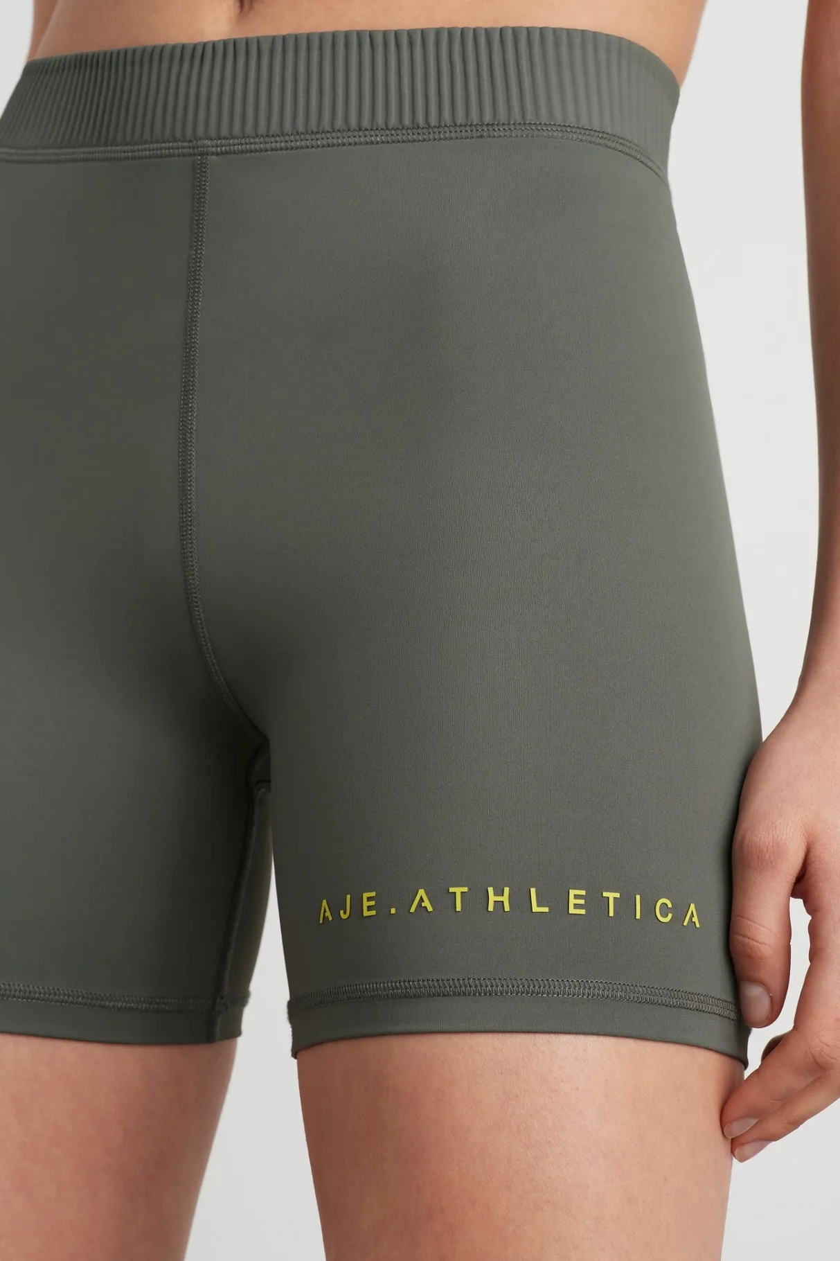 high_rise_pintuck_mid_length_bike_shorts__3.webp Discount Aje ATHLETICA High Rise Pintuck Mid Length Bike Shorts 625 Midnight Grey/Citrus Yellow