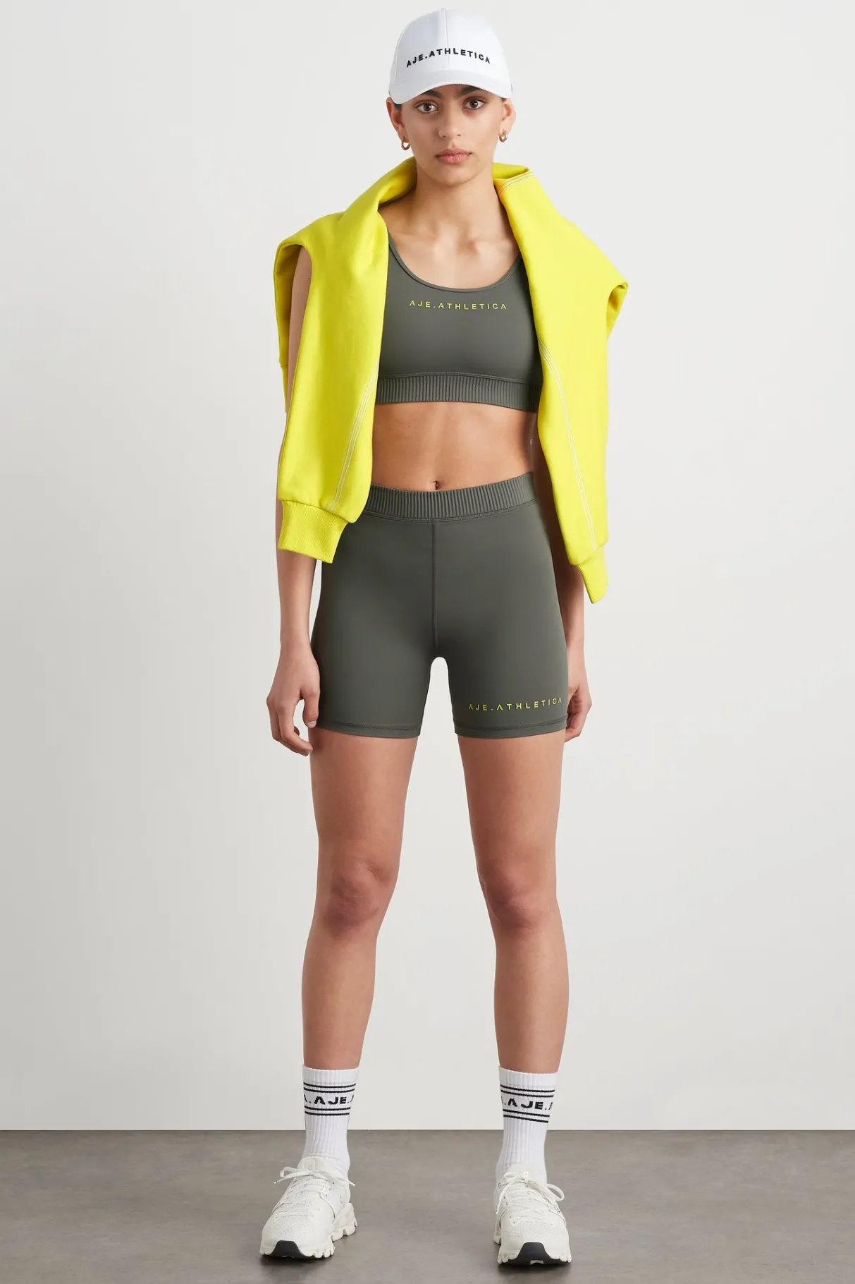 high_rise_pintuck_mid_length_bike_shorts__5.webp Discount Aje ATHLETICA High Rise Pintuck Mid Length Bike Shorts 625 Midnight Grey/Citrus Yellow