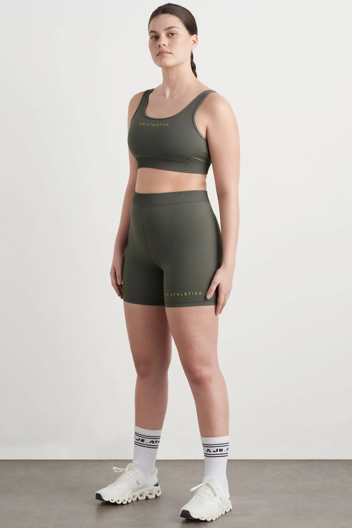 high_rise_pintuck_mid_length_bike_shorts__6.webp Discount Aje ATHLETICA High Rise Pintuck Mid Length Bike Shorts 625 Midnight Grey/Citrus Yellow