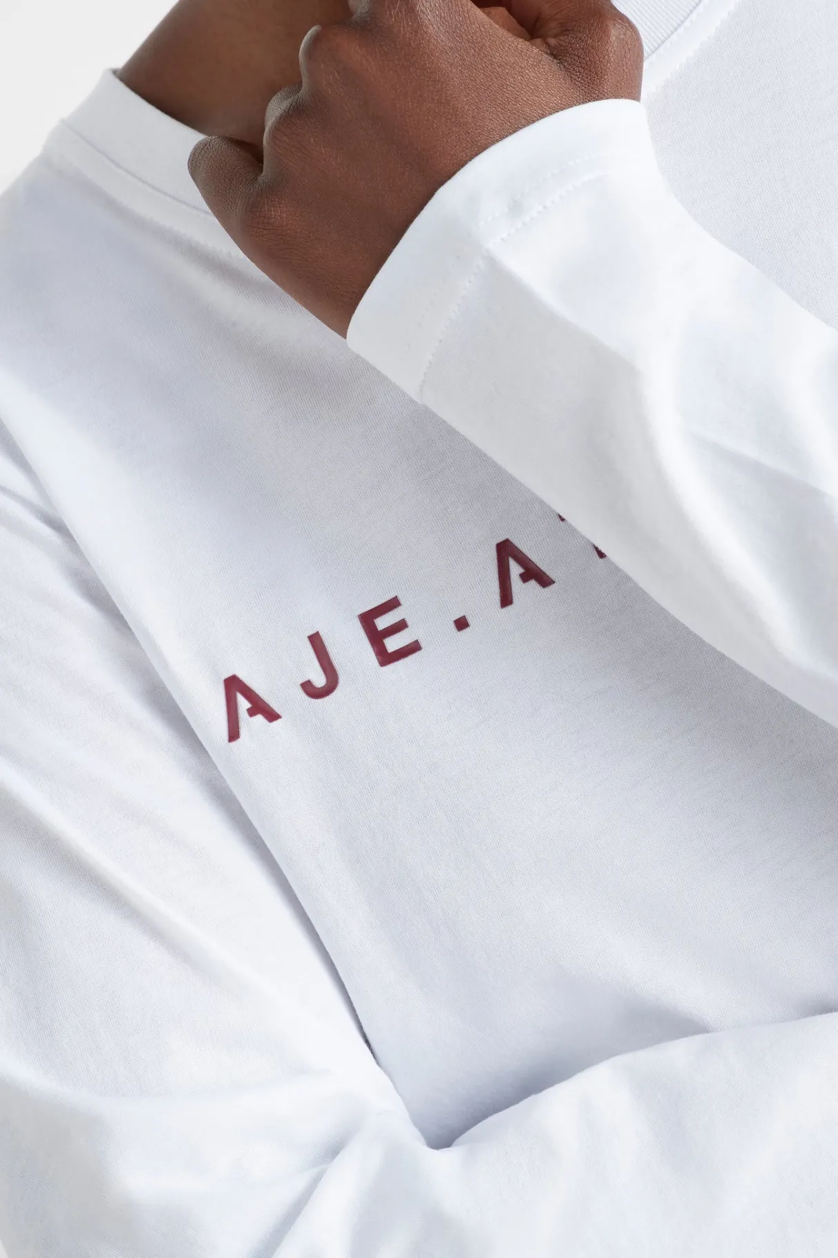 logo_long_sleeve_tshirt__7.webp Online Aje ATHLETICA Logo Long Sleeve T-Shirt 127 White/Burnt Burgundy