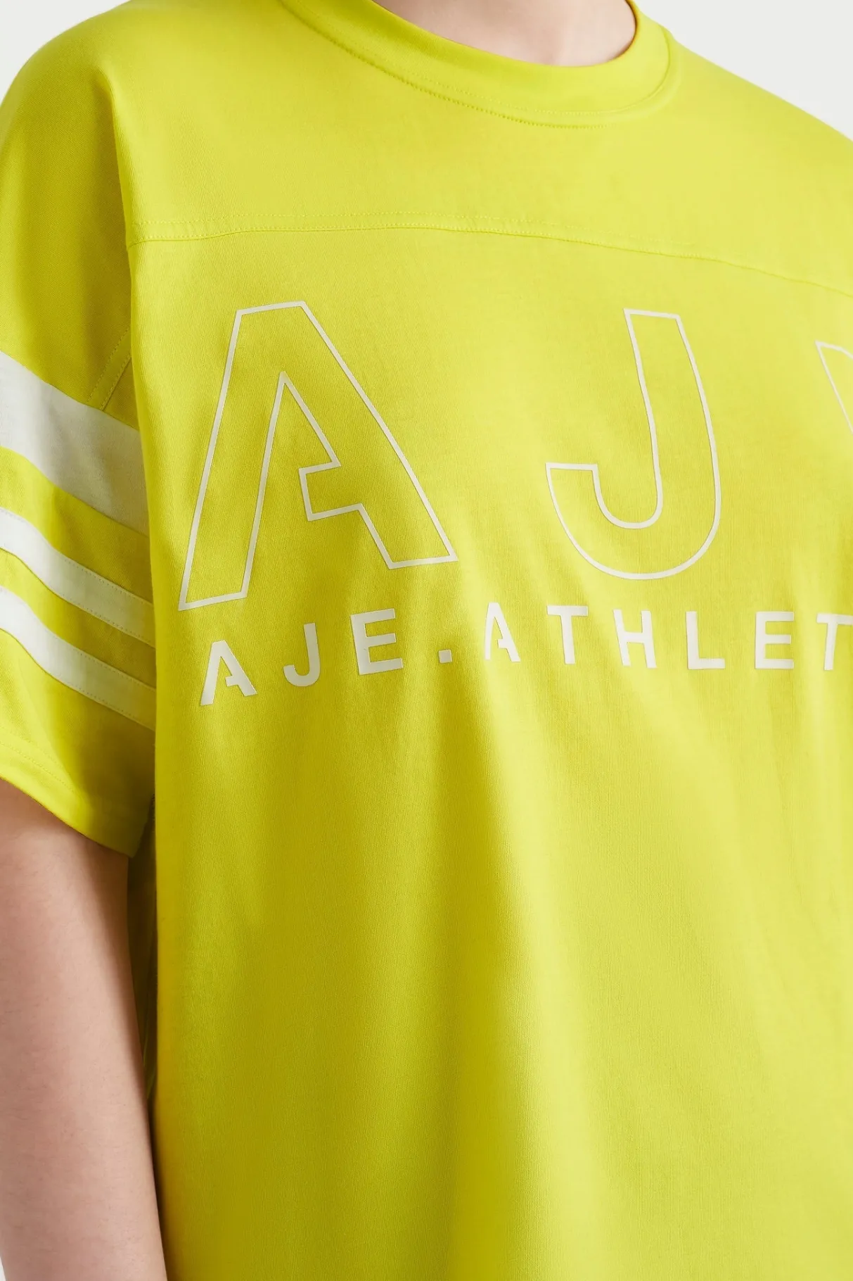logo_stripe_tshirt__7.webp New Aje ATHLETICA Logo Stripe T-Shirt 102 Citrus Yellow/Wht