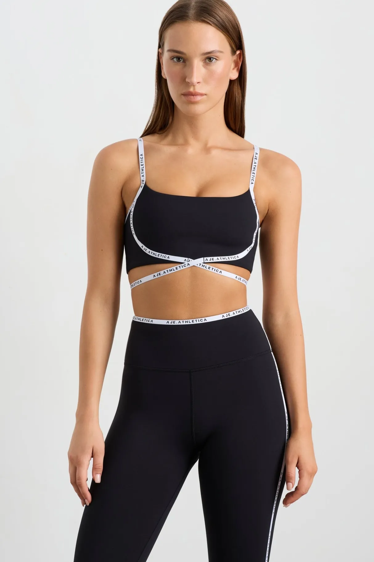 logo_tape_crossover_bra__0.webp Outlet Aje ATHLETICA Logo Tape Crossover Bra 393 Black/White