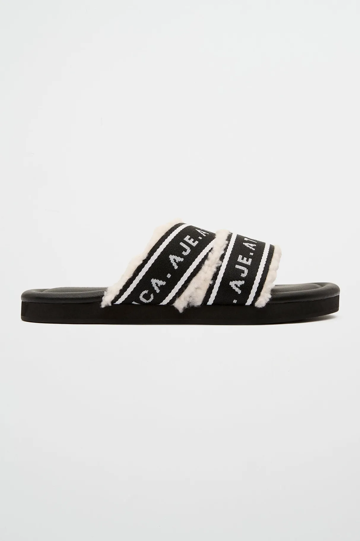 logotape_shearling_slides__0-1.webp Shop Aje ATHLETICA Logotape Shearling Slides 938 Black/White
