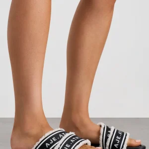 Shop Aje ATHLETICA Logotape Shearling Slides 938 Black/White