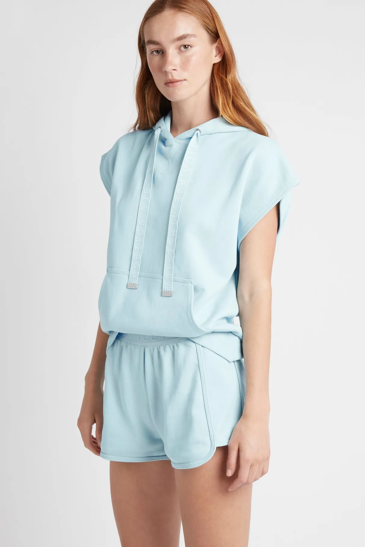 logotape_short_sleeve_hoodie__2.webp Online Aje ATHLETICA Logotape Short Sleeve Hoodie 403 Ice Blue