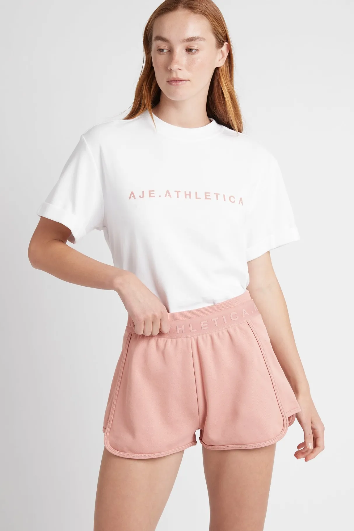 logotape_sweat_shorts__0-1.webp Shop Aje ATHLETICA Logotape Sweat Shorts 604 Sunset Pink