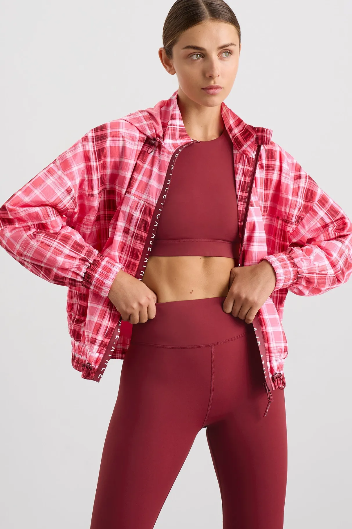 long_line_spray_jacket_0-1.webp Shop Aje ATHLETICA Long Line Spray Jacket Blurred Pink Check