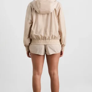 Shop Aje ATHLETICA Long Line Spray Jacket Latte Beige