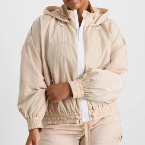 Shop Aje ATHLETICA Long Line Spray Jacket Latte Beige