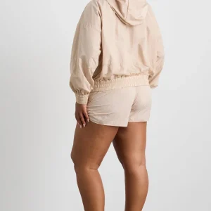 Shop Aje ATHLETICA Long Line Spray Jacket Latte Beige