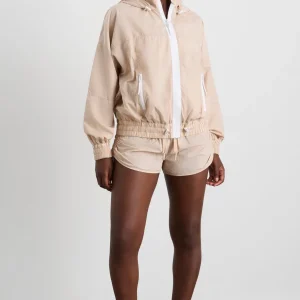 Shop Aje ATHLETICA Long Line Spray Jacket Latte Beige