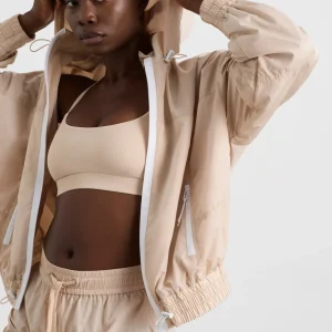 Shop Aje ATHLETICA Long Line Spray Jacket Latte Beige