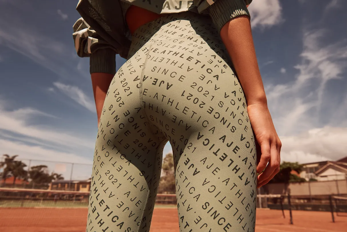 monogram_high_rise__legging__13.webp Shop Aje ATHLETICA Monogram High Rise 7/8 Legging 203 Sage/Forest Green
