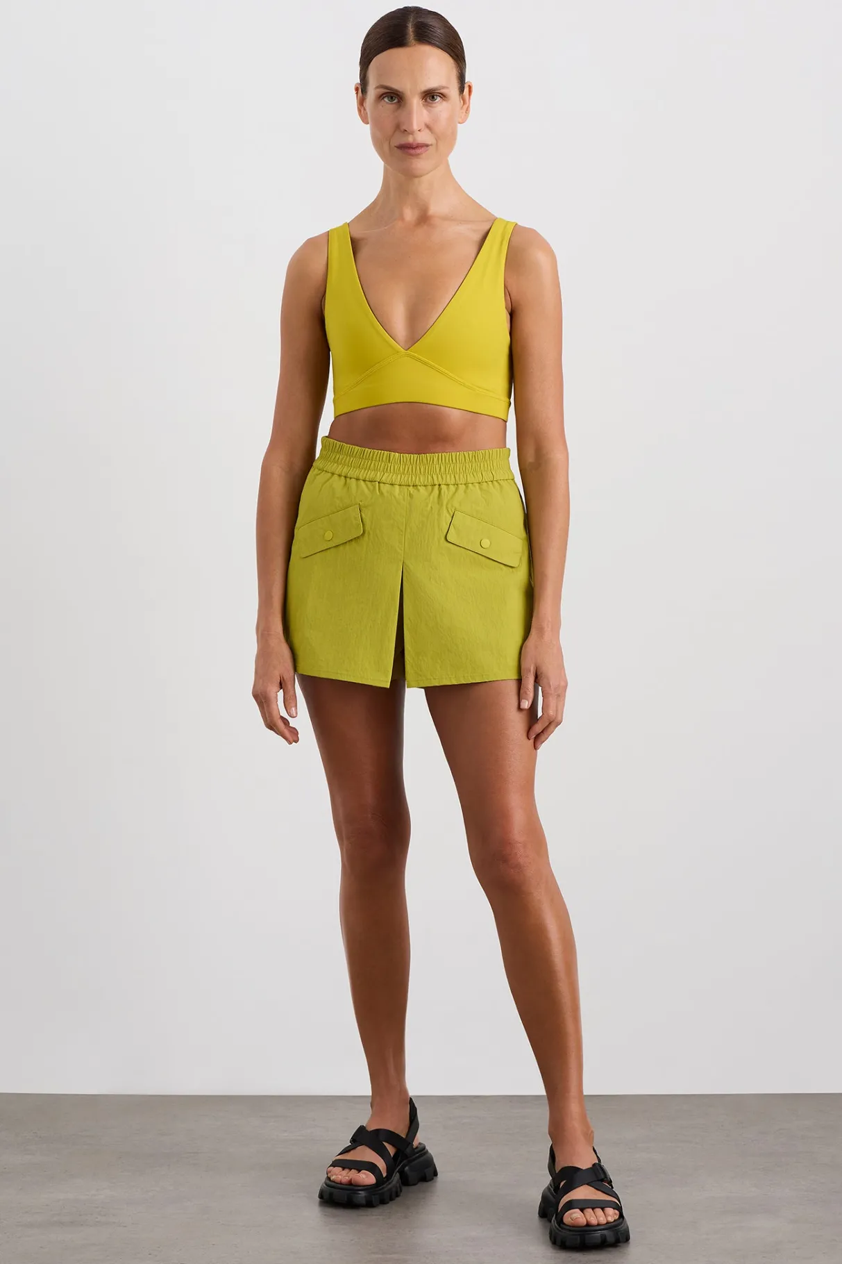pleated_spray_mini_short__2.webp Store Aje ATHLETICA Pleated Spray Mini Short 648 Solar Blaze
