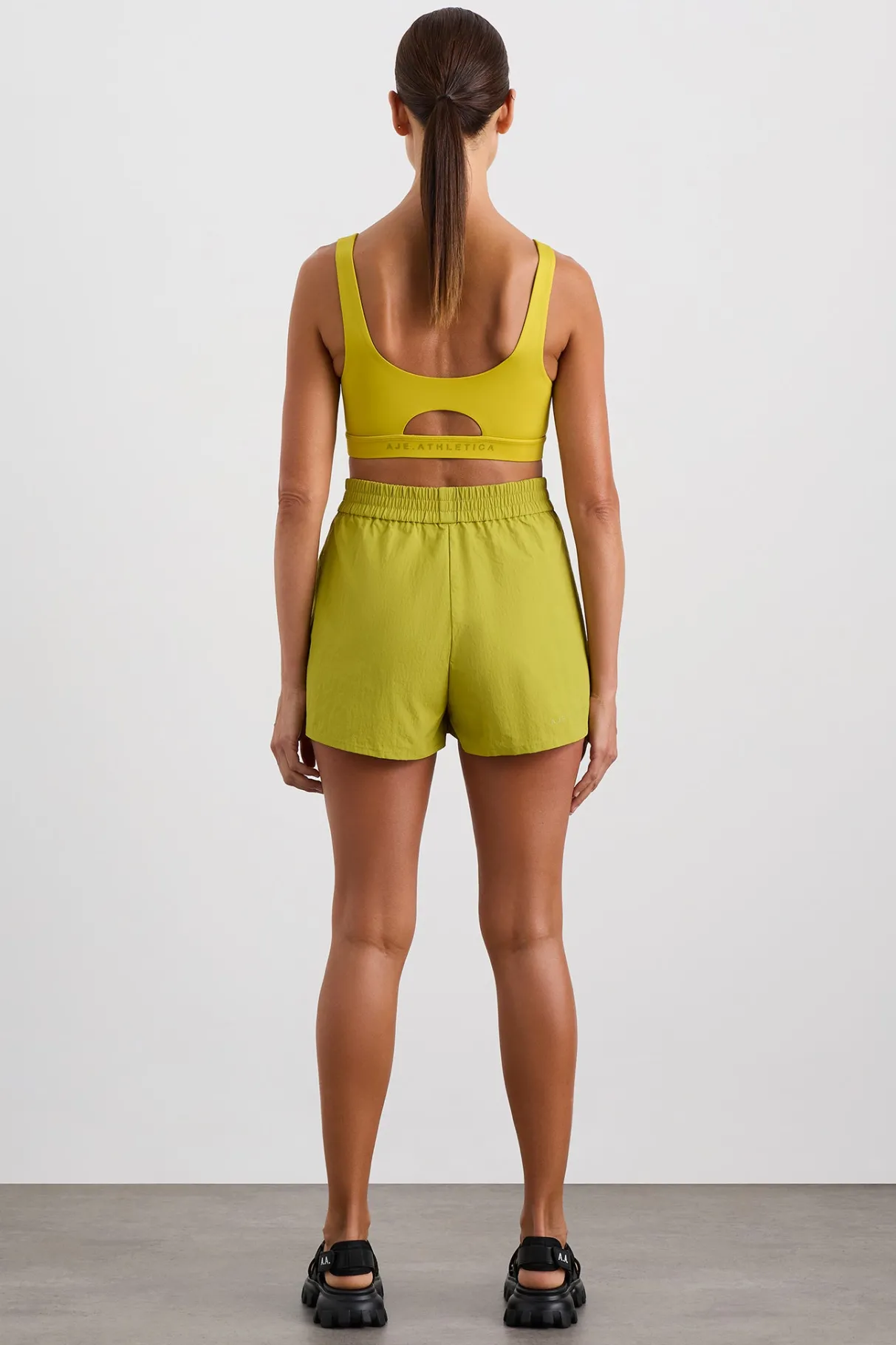 plunge_sports_bra__4.webp Shop Aje ATHLETICA Plunge Sports Bra 337 Solar Blaze