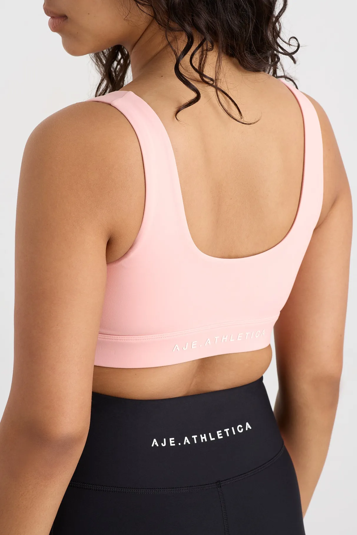 plunge_sports_bra__7-2.webp Shop Aje ATHLETICA Plunge Sports Bra 337 Millenial Pink